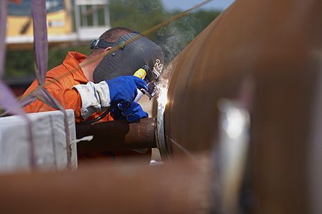 Cathodic protection. Welding sacraficial magnesium anodes to a support leg