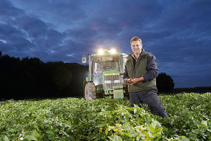 commercial Photographer, Potato harvest, tractor in field, night, farming